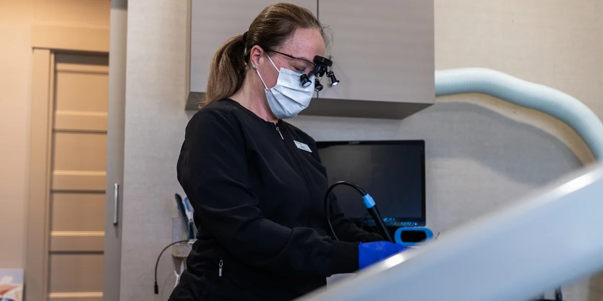 A patient receiving a routine dental cleaning and exam
